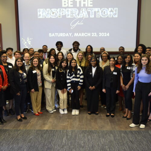 Group photo of the 2024 Georgia Youth Leadership Award winners and their coaches, taken Feb. 10, 2024 at their Meet & Greet luncheon in at Emory's Goizueta Business School.