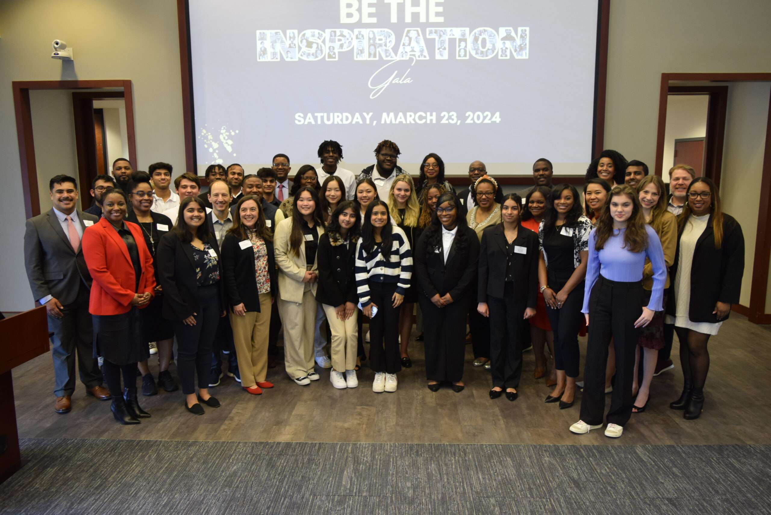 Group photo of the 2024 Georgia Youth Leadership Award winners and their coaches, taken Feb. 10, 2024 at their Meet & Greet luncheon in at Emory's Goizueta Business School.