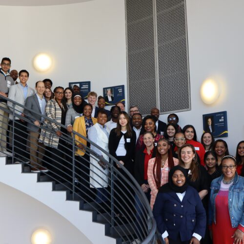 Group photo of the 2025 Georgia Youth Leadership Award winners and their coaches, taken Feb. 1, 2025 at their Meet & Greet luncheon in at Emory's Goizueta Business School.
