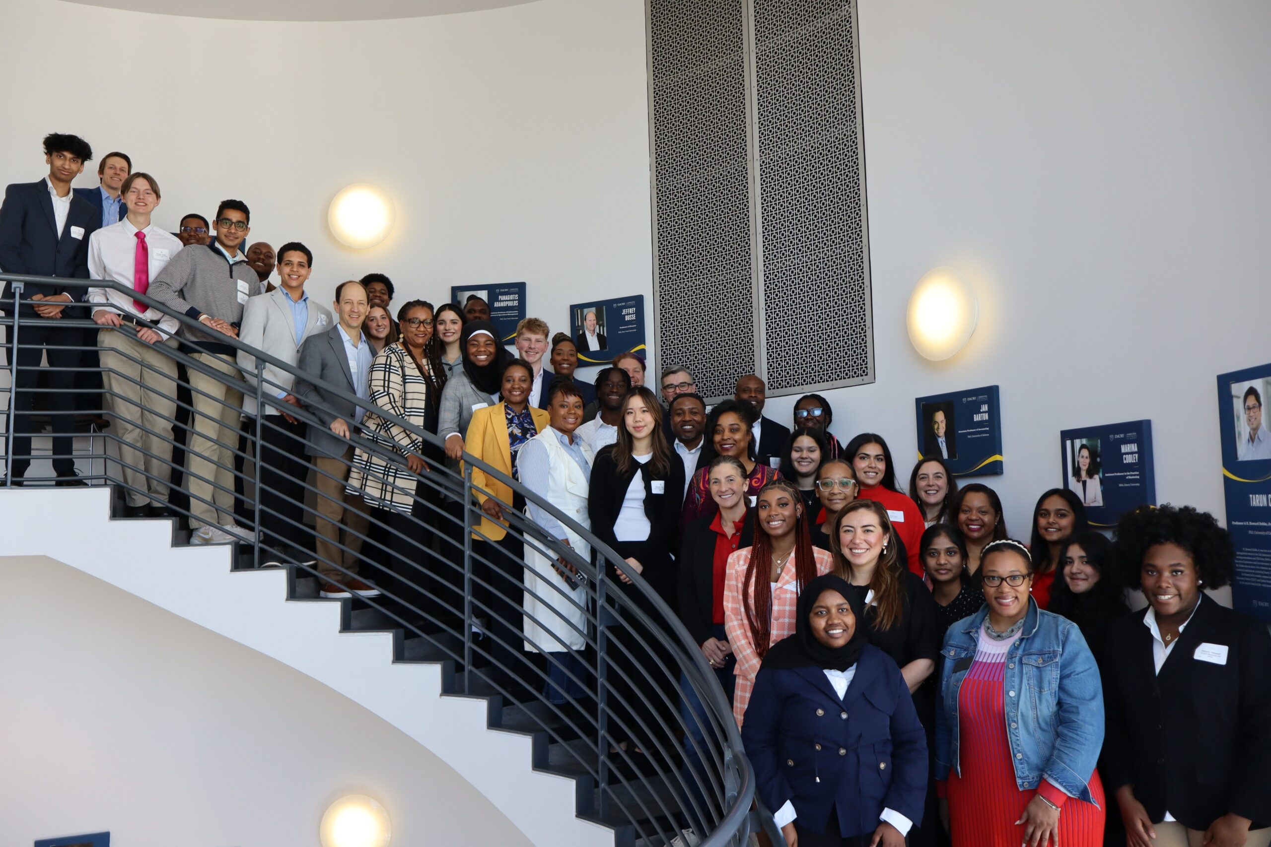 Group photo of the 2025 Georgia Youth Leadership Award winners and their coaches, taken Feb. 1, 2025 at their Meet & Greet luncheon in at Emory's Goizueta Business School.